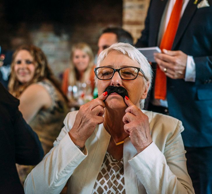 Fake Moustache | Wedding Guests | Rustic Wedding at Yoghurt Rooms in Sussex | Louise Griffin Photography