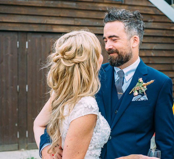 Bride in Ivy & Aster Secret Garden Wedding Dress | Groom in Navy Reiss Suit | Rustic Wedding at Yoghurt Rooms in Sussex | Louise Griffin Photography