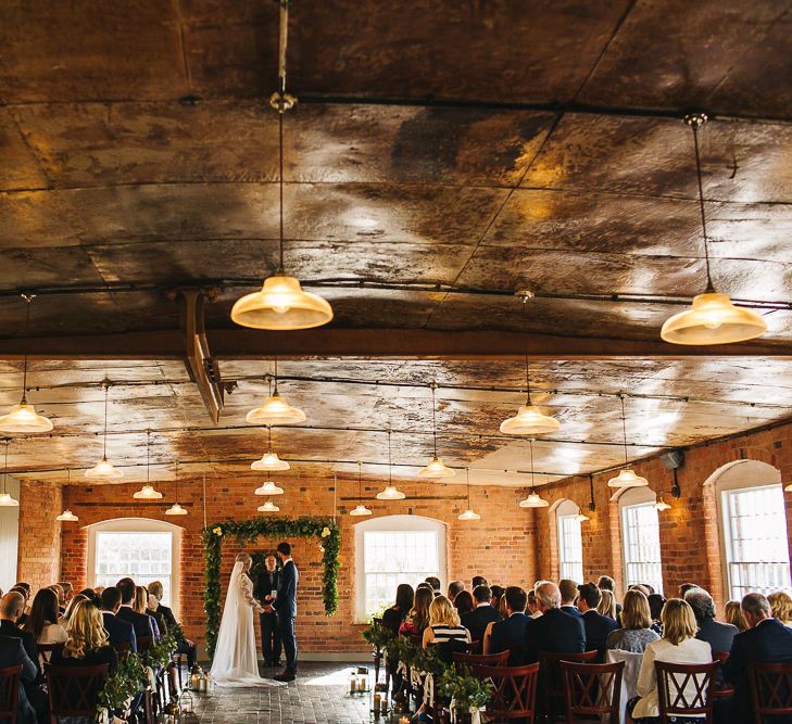 Industrial Wedding Ceremony at The West Mill | Greenery Floral Arch | S6 Photography