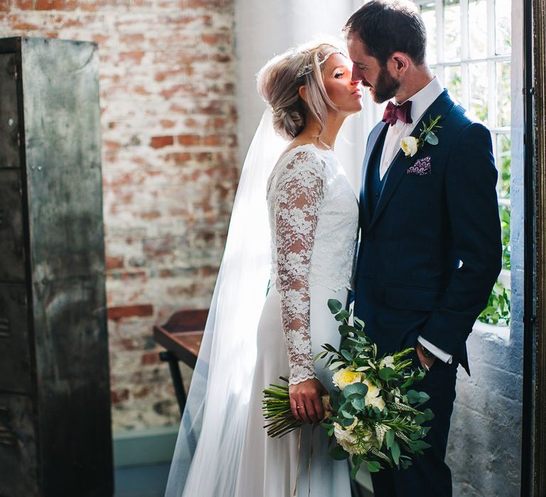 Bride in Charlie Brear Torum Dress & Adrianna Lace Jacket | Groom in Bespoke Michelsberg Tailoring Suit & Bow Tie | S6 Photography