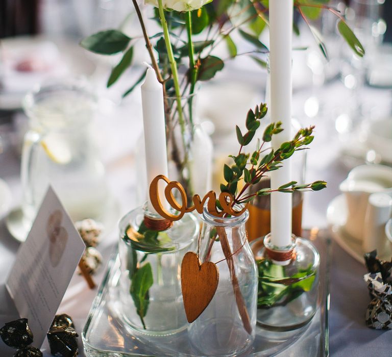 White & Green Flower Stems in Bottles with Copper Table Numbers | S6 Photography