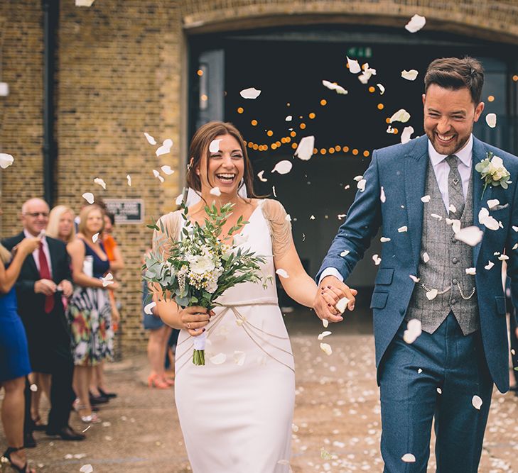 Bride in Luella's Bridal Boutique Nuria Gown & Groom in Jack Bunneys Suit