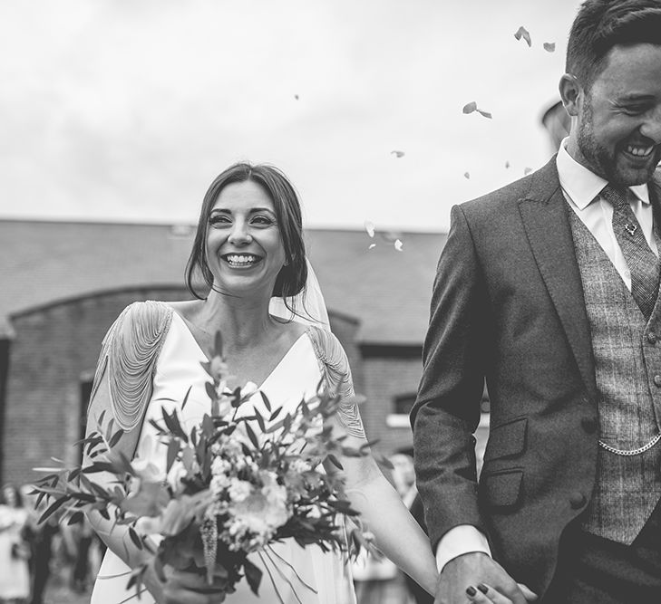 Bride in Luella's Bridal Boutique Nuria Gown & Groom in Jack Bunneys Suit