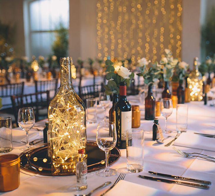 Table Setting with Brown Bottles & Gold Spray Painted Jars