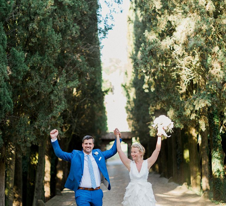 Bride in Monique L'Huillier Skirt, Bridal Separates | Groom in Light Blue Baldessarini Suit | Linda Nari Photography