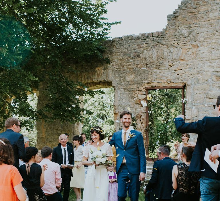 Boho Bride in Bespoke Lace Bridal Separates | Groom in Blue Suit | Chic Rustic French Wedding at Le Morimont Styled by Féelicité | Photography by Chloe