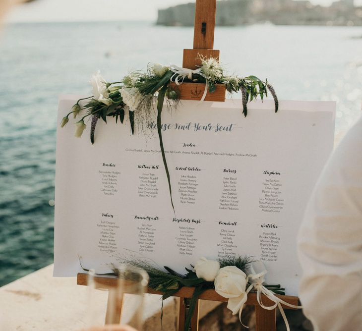 Table Plan with Greenery & White Flower Decor | Destination Croatia Wedding | Jere Satamo Photography