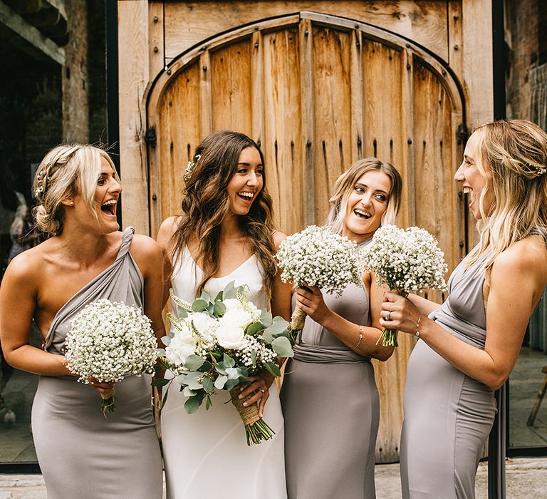 Bridesmaids in Grey ASOS Multiway Dresses | Bride in Martina Liana Bridal Gown from Coco and Kate | Gypsopila Bouquet | Alex Tenters Photography