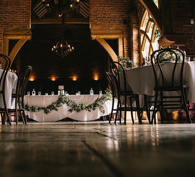 Greenery & White Top Table Floral Arrangement by Lilly White Florist | Alex Tenters Photography