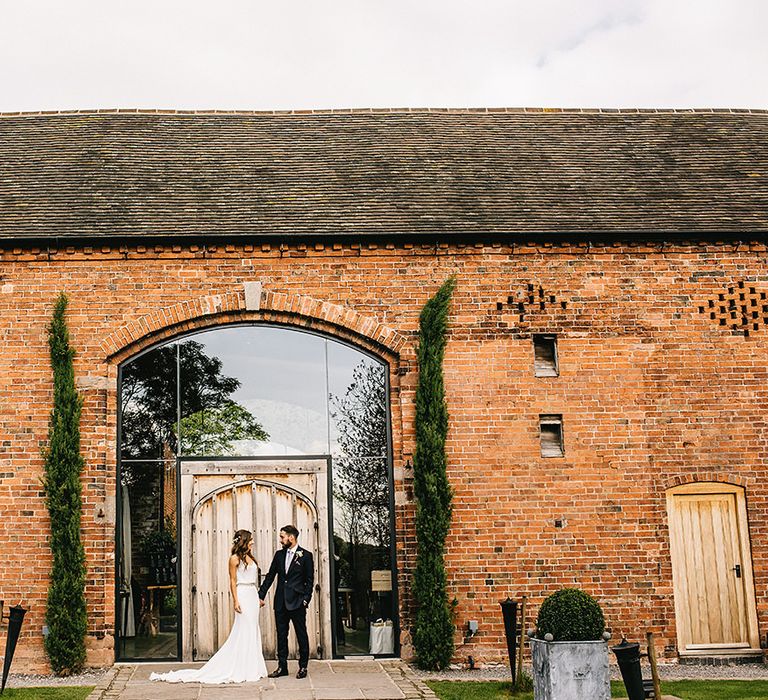 Shustoke Farm Barn Wedding | Bride in Martina Liana Bridal Gown from Coco and Kate | Groom in Reiss Bespoke Tailoring Suit | Alex Tenters Photography