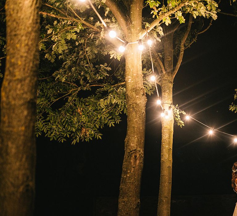 Festoon Lights | Bride in Martina Liana Bridal Gown from Coco and Kate | Groom in Reiss Bespoke Tailoring Suit | Alex Tenters Photography