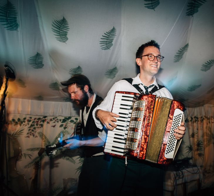 Groom Playing The Accordian