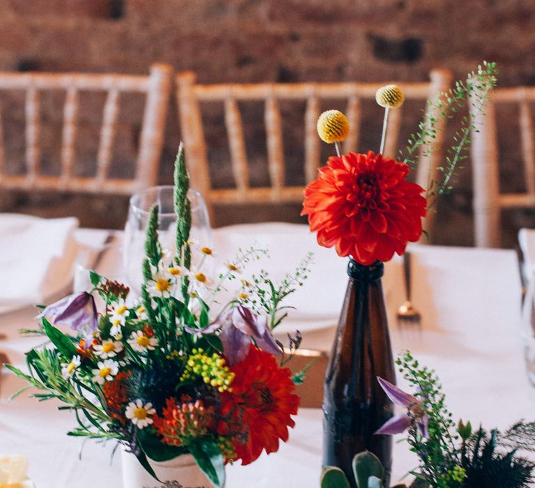 Rustic Tree Slice Centrepiece with Flower Stems in Jars & Vases