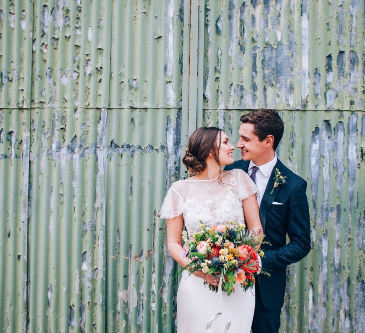 Bride in David Fielden Wedding Dress & Groom in Reiss Suit