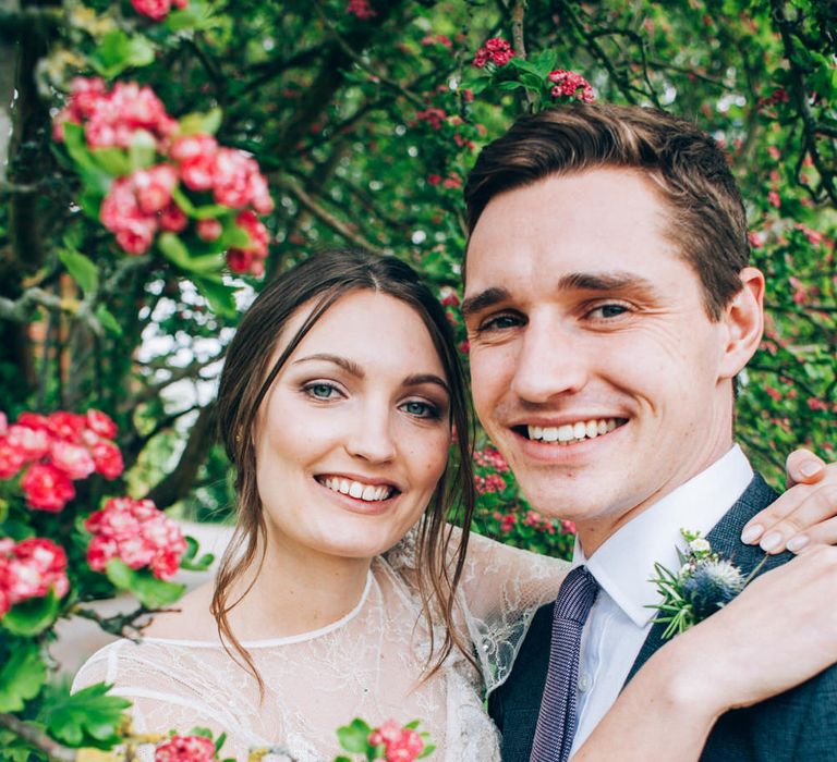 Bride in David Fielden Wedding Dress & Groom in Reiss Suit