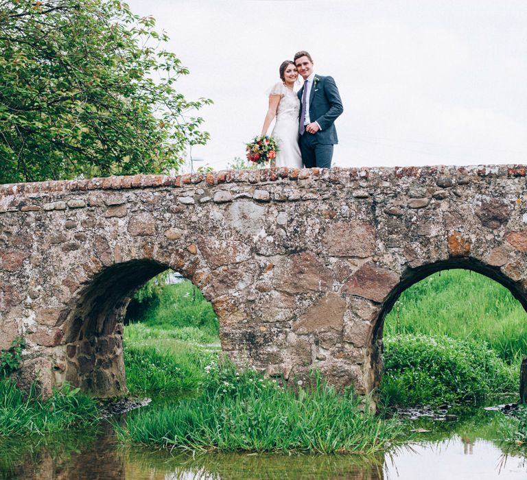 Bride in David Fielden Wedding Dress & Groom in Reiss Suit