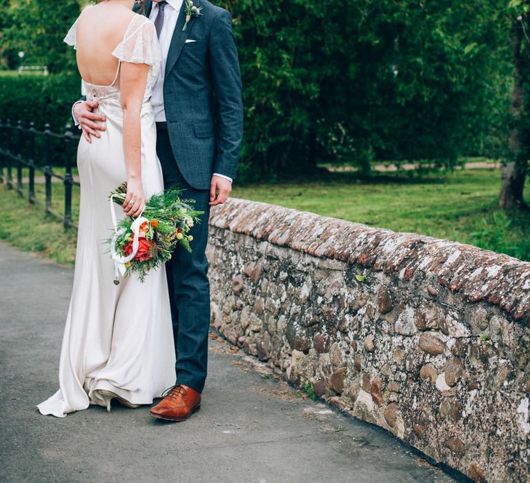 Bride in David Fielden Wedding Dress & Groom in Reiss Suit