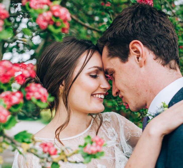 Bride in David Fielden Wedding Dress & Groom in Reiss Suit