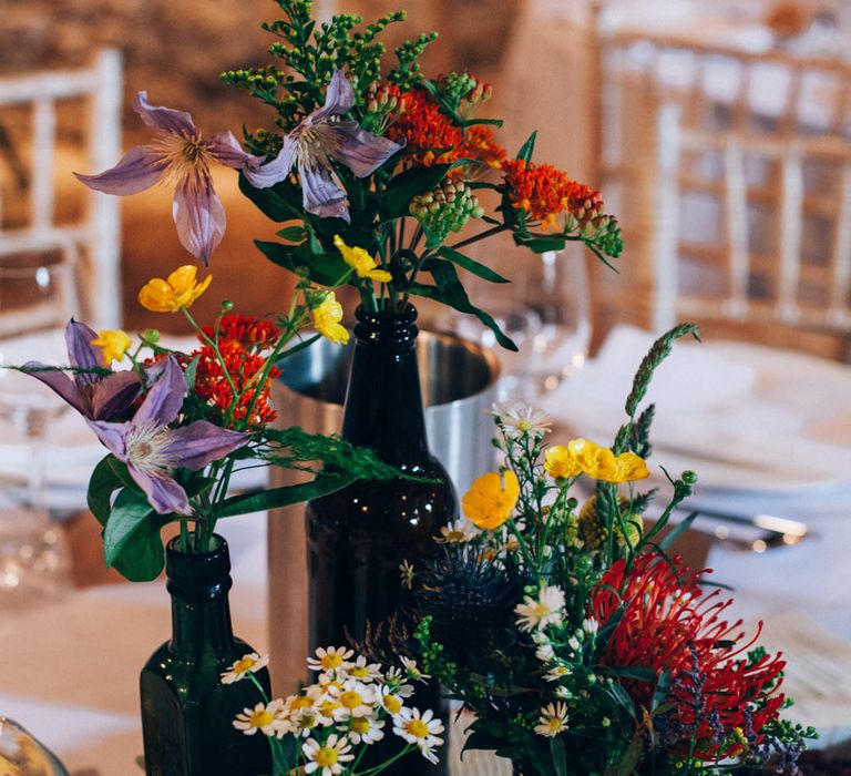 Rustic Tree Slice Centrepiece with Flower Stems in Jars & Vases