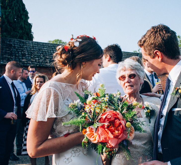 Bride in David Fielden Wedding Dress & Groom in Reiss Suit