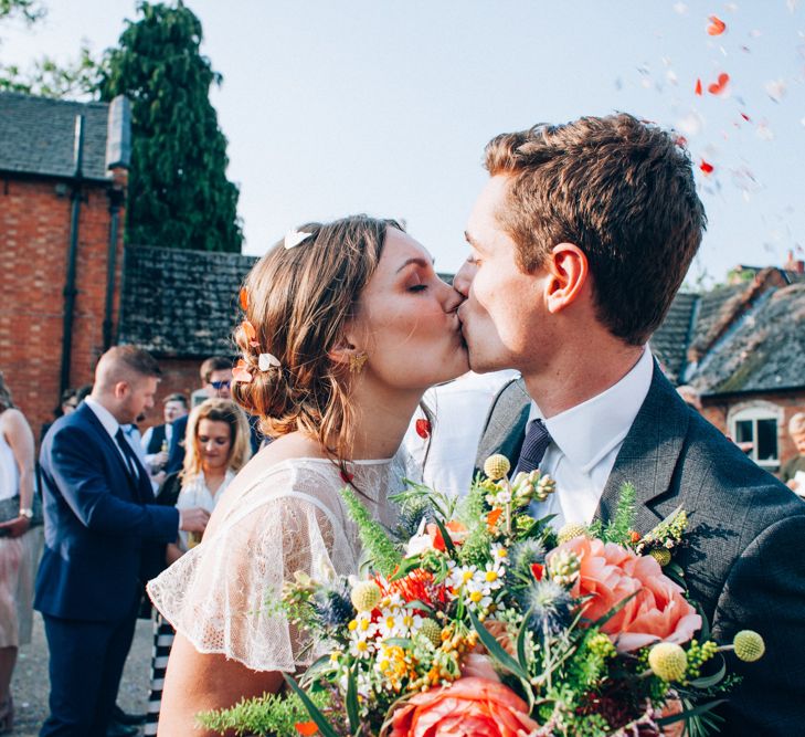 Confetti Moment with Bride in David Fielden Wedding Dress & Groom in Reiss Suit