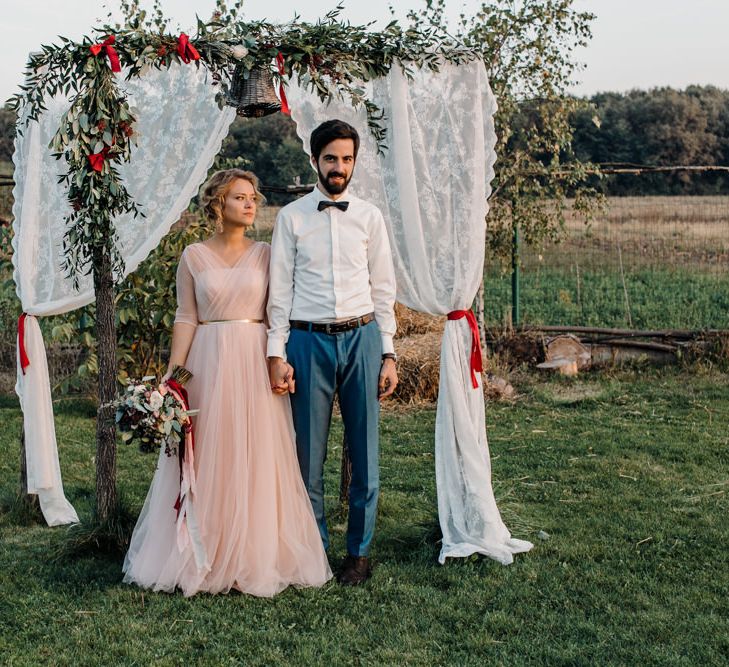 Outdoor Altar with Bride in Bespoke Pink Tulle Gown & Groom in Vitale Barberis Canonico Suit