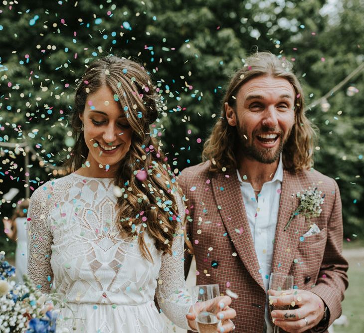 Confetti Moment | Bride in Grace Loves Lace | Groom in Brown Check Suit | Outdoor Woodland Wedding at The Dreys in Kent | Fern Edwards Photography