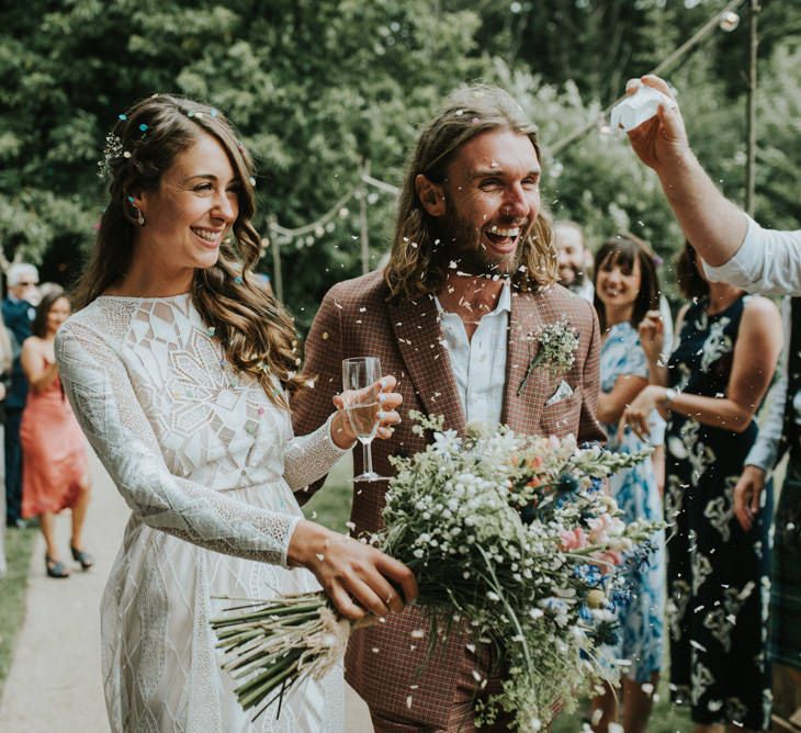 Confetti Moment | Bride in Grace Loves Lace | Groom in Brown Check Suit | Outdoor Woodland Wedding at The Dreys in Kent | Fern Edwards Photography