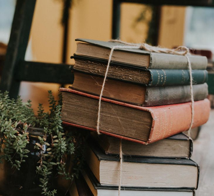 Vintage Books Wedding Decor | Outdoor Woodland Wedding at The Dreys in Kent | Fern Edwards Photography