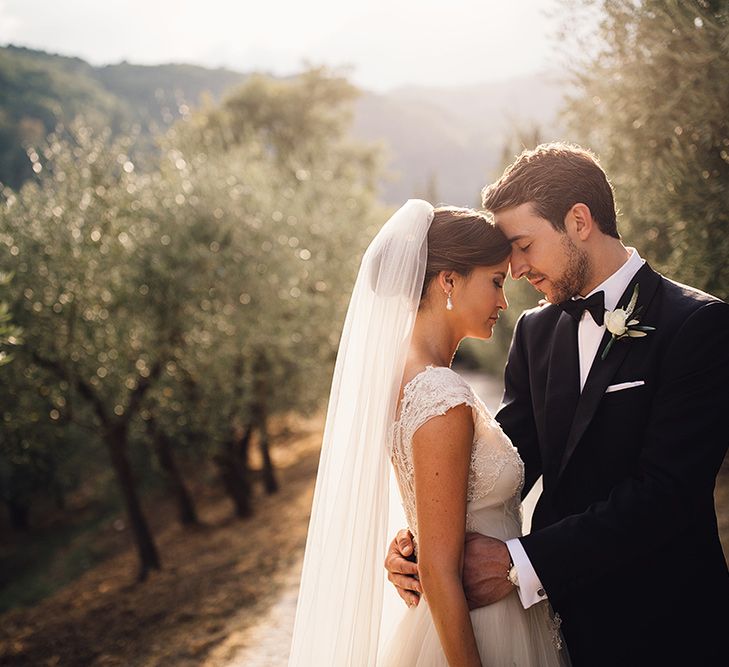 Bride in Customised David Fielden Wedding Dress and Groom in Cad & The Dandy Suit Sunset Portrait