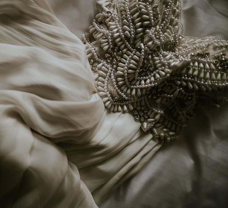 Close up of white beaded wedding dress 