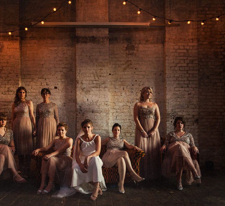 Warm & moody group shot of bride and bridesmaids