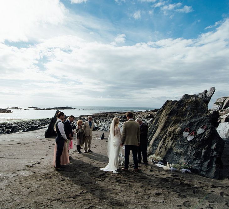 Intimate Beach Elopement In Devon With Bride In Bespoke Dress & Images By Liberty Pearl Photography