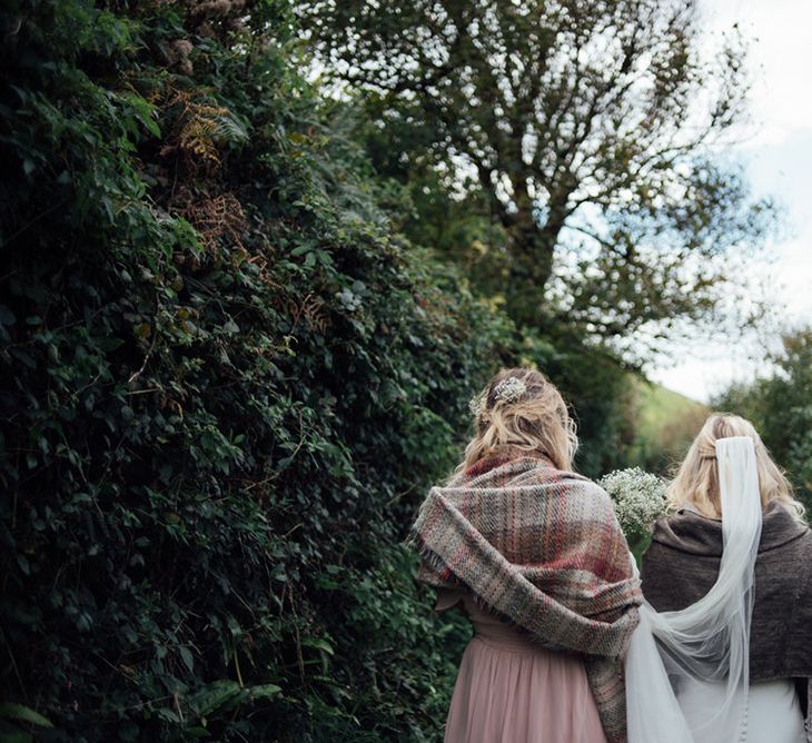 Bride & Bridesmaid Walking To Wedding