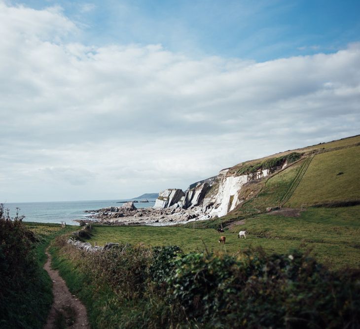 Intimate Beach Elopement In Devon With Bride In Bespoke Dress & Images By Liberty Pearl Photography