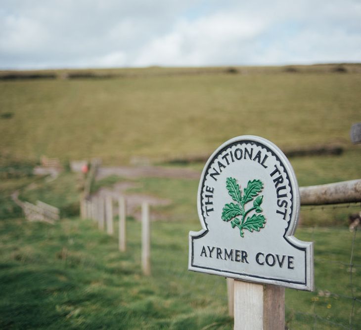 Intimate Beach Elopement In Devon With Bride In Bespoke Dress & Images By Liberty Pearl Photography