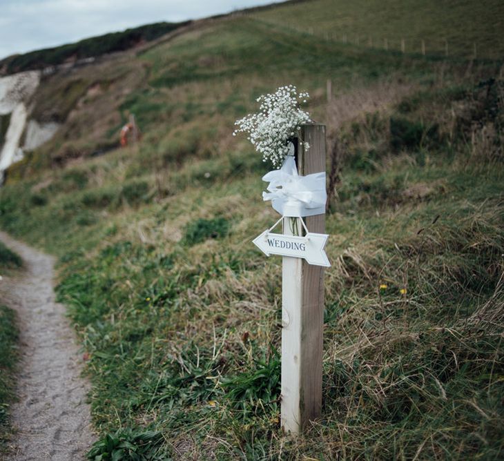 Intimate Beach Elopement In Devon With Bride In Bespoke Dress & Images By Liberty Pearl Photography