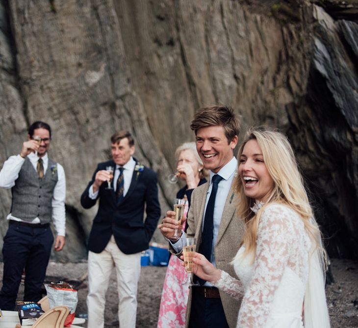 Intimate Beach Elopement In Devon With Bride In Bespoke Dress & Images By Liberty Pearl Photography