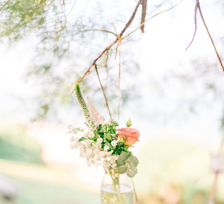 Hanging Flower Stems in Glass Bottles