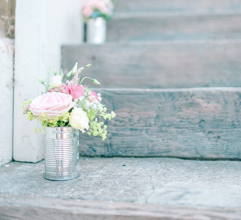 Wedding Flowers in Tin Cans Lining the Steps