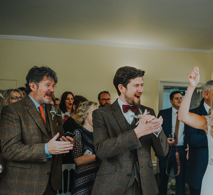 Wedding Ceremony with Bride in Anais Anette Savannah Bridal Gown & Groom in Walker Slater Tweed Suit