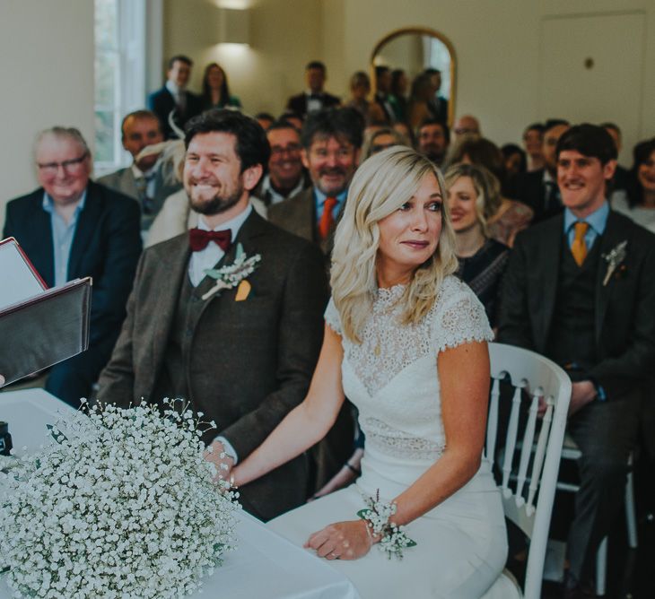 Wedding Ceremony with Bride in Anais Anette Savannah Bridal Gown & Groom in Walker Slater Tweed Suit