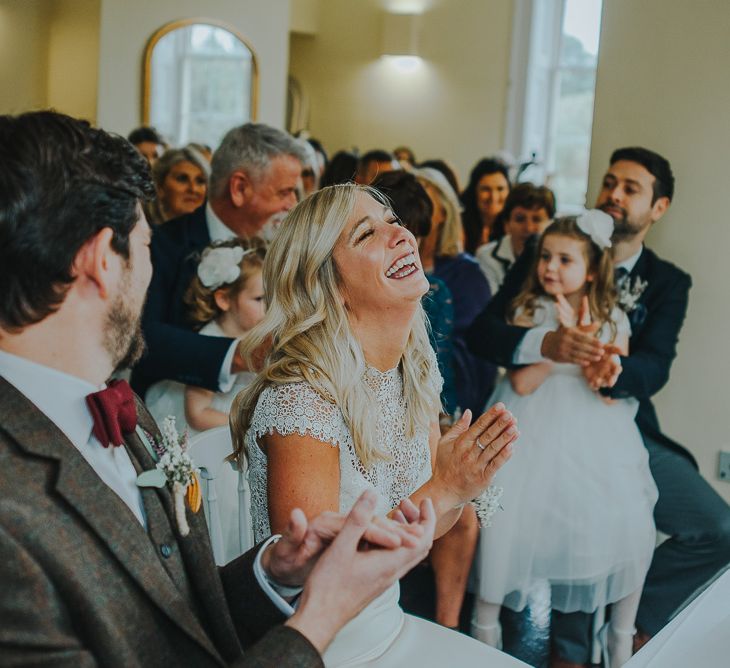 Wedding Ceremony with Bride in Anais Anette Savannah Bridal Gown & Groom in Walker Slater Tweed Suit