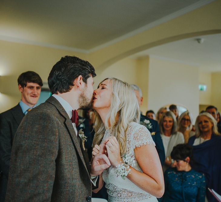 Wedding Ceremony with Bride in Anais Anette Savannah Bridal Gown & Groom in Walker Slater Tweed Suit