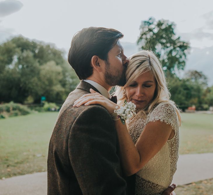 Bride in Anais Anette Savannah Bridal Gown & Groom in Walker Slater Tweed Suit