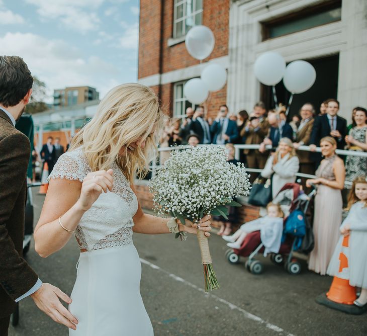 Bride in Anais Anette Savannah Bridal Gown & Groom in Walker Slater Tweed Suit