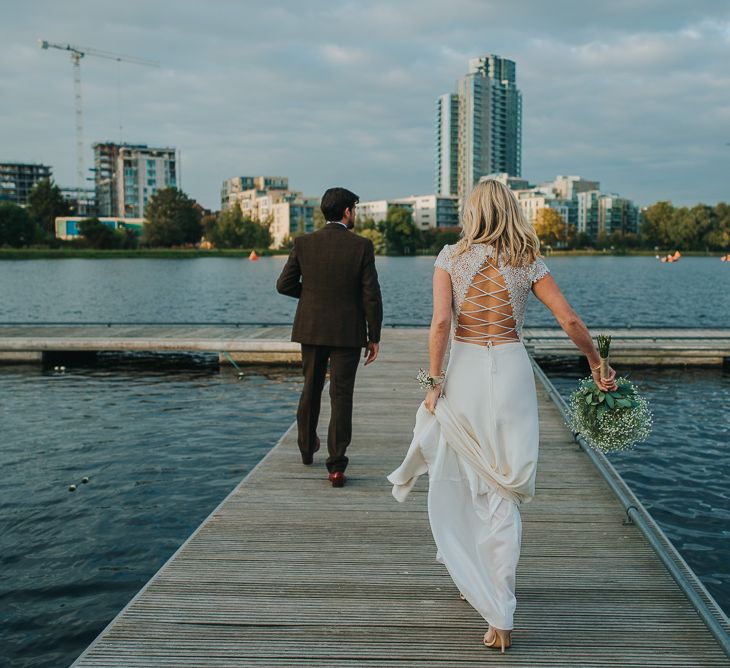 Bride in Anais Anette Savannah Bridal Gown & Groom in Walker Slater Tweed Suit