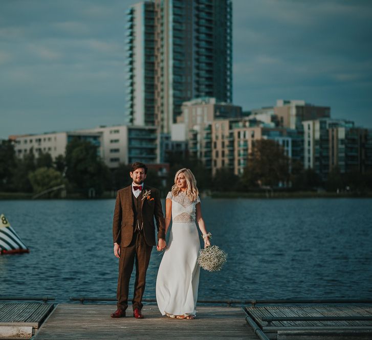 Bride in Anais Anette Savannah Bridal Gown & Groom in Walker Slater Tweed Suit