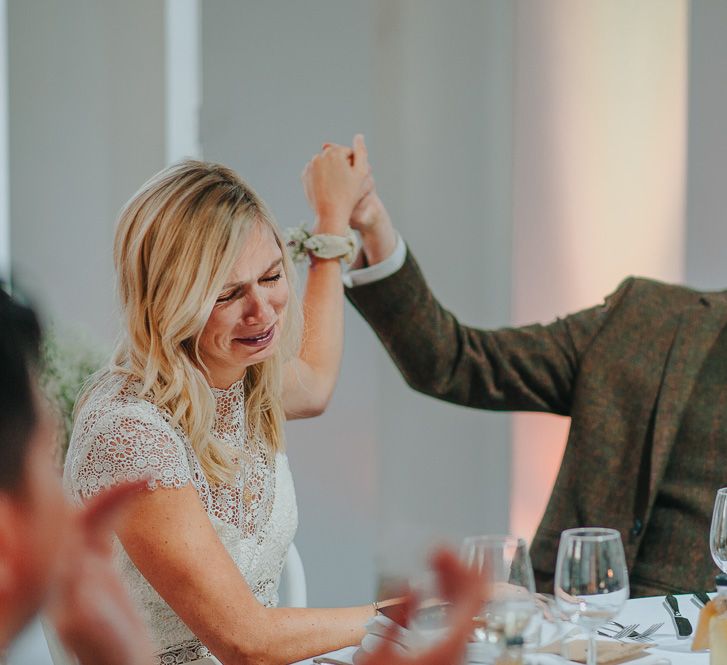 Bride in Anais Anette Savannah Bridal Gown & Groom in Walker Slater Tweed Suit