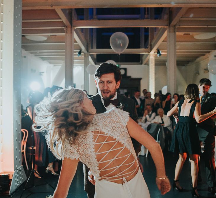 Bride in Anais Anette Savannah Bridal Gown & Groom in Walker Slater Tweed Suit